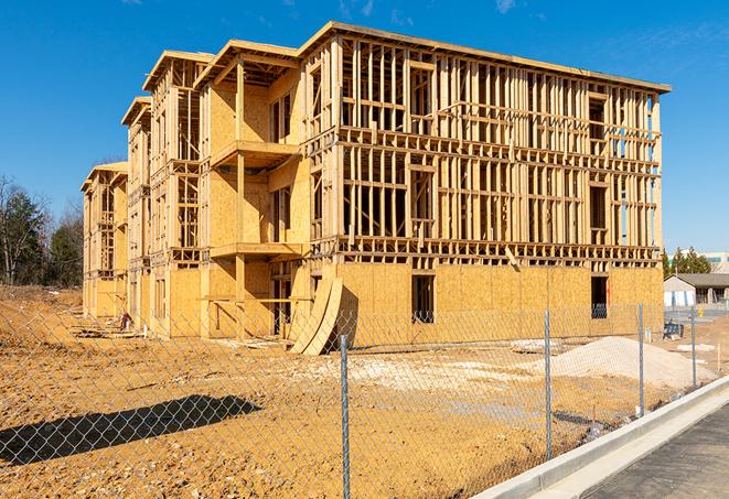 construction zone secured with a temporary fence, marked with warning signs in Rossmoor, CA